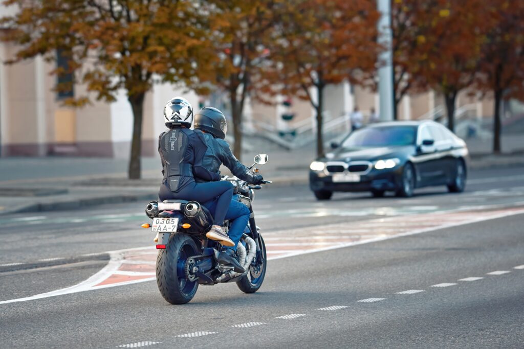two people riding a motorcycle